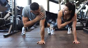 Toning Bingo Wings: Your Ultimate Guide to Sculpting Sleek Arms at the Gym 3 Fitness trainer demonstrating arm toning exercises Teddington
